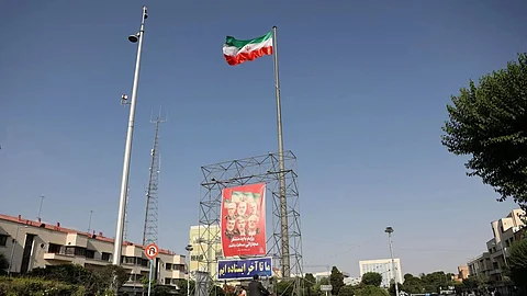 Pictures of those killed in Israeli strikes on Iran are displayed on a street, in Tehran, Iran.