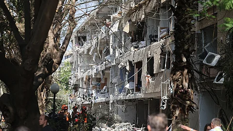Israeli security forces and first responders gather at the site of an Iranian strike that hit a residential neighbourhood.