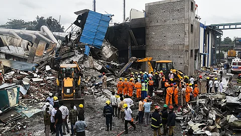 Emergency services personnel at the site after an explosion at a pharma plant