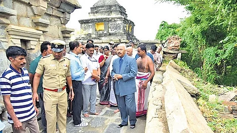 Upa Lokayukta Justice KN Phaneendra visits ancient Srirama Temple in Channapatna taluk on Saturday after the temple wall collapsed.