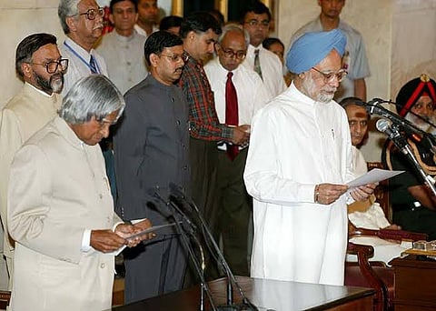 Dr Manmohan Singh being sworn-in as Prime Minister of India by the then President Dr APJ Abdul Kalam in New Delhi in 2004. Photo/PIB GOI