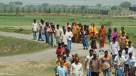 People near the India-Bangladesh border. The Indian government views illegal Muslim immigrants from Bangladesh as infiltrators’.