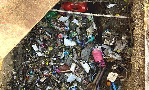 Discarded plastic bottles, medical waste, and chemical containers find their way into Dal Lake through unchecked drainage systems.
