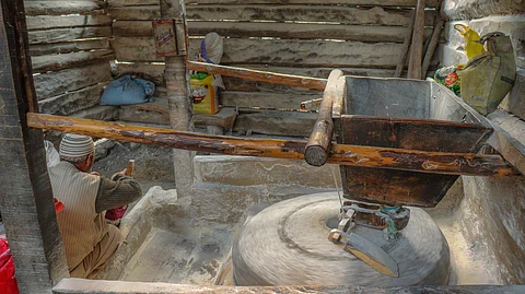 Ghulam Nabi at Mund-Daji, Rafiabad, operates the Age-Old Watermill to Serve Freshly Milled Flour to Locals especially customers.