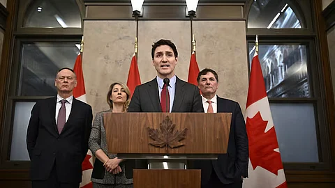 Prime Minister Justin Trudeau addresses the media following the imposition of a raft of tariffs by U.S. President Donald Trump against Canada, Mexico and China, in Ottawa on Saturday. Public Safety Minister David McGuinty, left to right, Foreign Affairs Minister Mélanie Joly and Finance Minister Dominic LeBlanc look on.