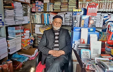 Mohammad Iqbal Kitab, the youngest son of Noor Mohammad, sitting at his ancestral historical bookshop in Maharaj Gunj, Srinagar, Kashmir.