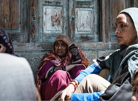 Tears for a Slain Civilian: Neighbours at Ghulam Rasool Magray’s house, where he was shot dead by unidentified gunmen on April 26, 2025 night in Kupwara district of Kashmir.
