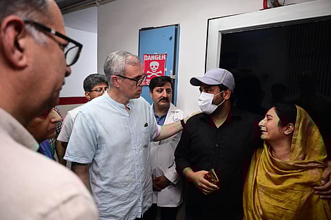 J&K chief minister Omar Abdullah interacting with family members of those injured in border firing and shelling at GMC Hospital in Jammu on Friday.