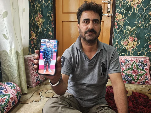 Aijaz Ahmad Kaloo, seated at his home in Srinagar’s Fateh Kadal, holds up a phone displaying a photograph of his nephew, Numan Sofi. Speaking to Kashmir Times, he recalls the young boy with a mix of pain and longing, as memories now reside in pictures and silence.
