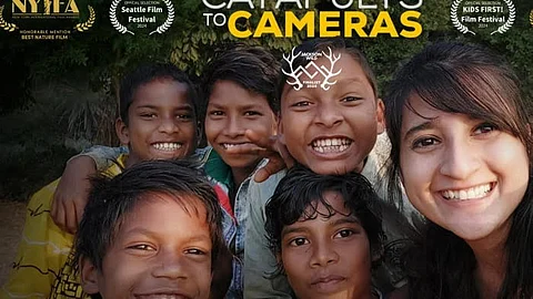 Five children, who were given cameras for recording images of wildlife in West Bengal, with Ashwika Kapur, director of the film, "Catapults to Cameras".