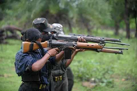 Indian Maoists ready their weapons as they take part in a training camp in a forested area of Bijapur District in the central Indian state of Chhattisgarh on July 8, 2012.