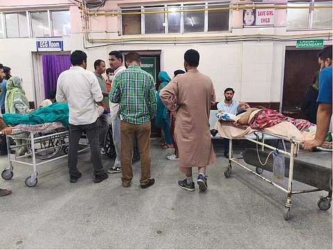 Patients waiting patiently outside the ultrasound room, as the SMHS Hospital, Srinagar, has only one emergency ultrasound facility serving all cases.