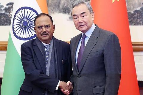 Chinese Foreign Minister Wang Yi with Indian National Security Adviser Ajit Doval, in Beijing on December 18, 2023.