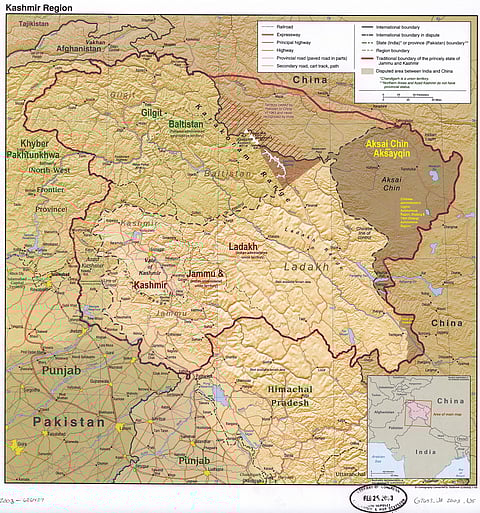 A map of the disputed Kashmir region with two Pakistan-administered areas shaded in sage-green.