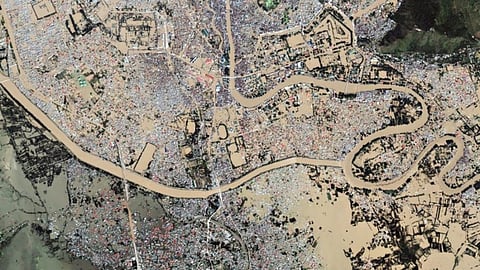 A satellite image of Srinagar, as viewed on Google Crisis Maps. September 2014. The 42-kilometer long flood channel dug in 1904 exits from a bend in the Jhelum and goes to the left of the picture.