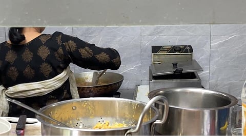 A woman cooking food in a northeastern restaurant in Delhi. The image is representational.