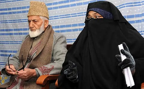 A file photo of Asiya Andrabi with separatist leader Syed Ali Shah Geelani.