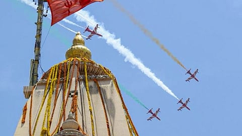 In this image posted on May 11, 2026, Indian Air Force's (IAF) Surya Kiran Aerobatic Team (SKAT) performs manoeuvres during the Somnath Amrut Mahotsav, which marks 75 years of the inauguration of the restored temple dedicated to the Hindu deity Shiva, at the temple, in Veraval, Gir Somnath district, Gujarat.