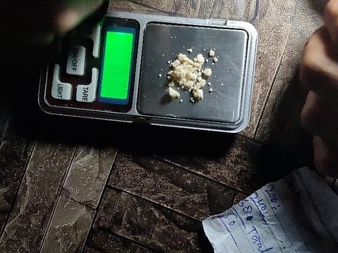 Image shows H on weigh scale, was taken by Mushtaq and is saved on his phone as a dark memory of the most expensive “10 grams”, heavy on his life.