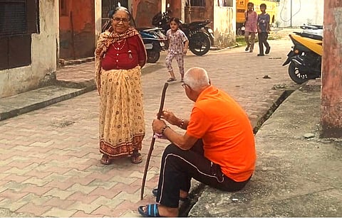 An elderly Kashmiri Pandit couple spends time outside their settlement at Jagti township in Jammu.