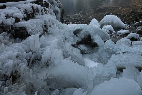 Huge icicles hang from a drinking water pipe at Tangmarg in Baramulla district of Kashmir on Friday, December 14, 2023, where cold wave has intensified during the winters. KT Photo/Sajad Ahmad
