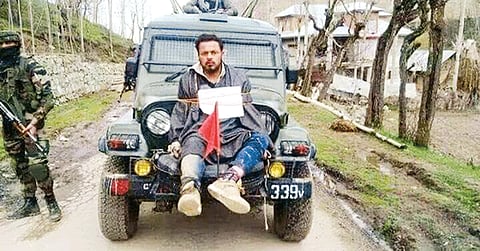 A file photo of Farooq Ahmed Dar tied on front of an Army Jeep on election day in Kulgam.