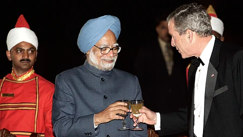 A file photo of US President George W Bush and Indian Prime Minister Dr Manmohan Singh after the signing of Nuclear Agreement in 2006. Photo/PIB