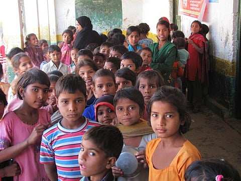 Children waiting to receive vaccinations in the northern Indian state of Uttar Pradesh. The measles vaccine saved an estimated 57 million lives between 2000 and 2022. Alan Janssen, MSPH Public domain. Credits Public Domain