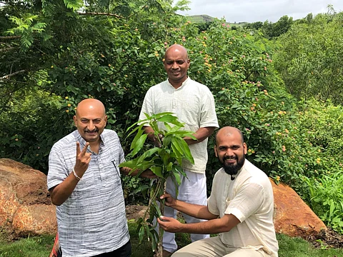Peace activists Nitin Sonawane, Jalandharnath Channole and Yogesh VishwaMitra with the Chausa sapling gifted by a Pakistani farmer.