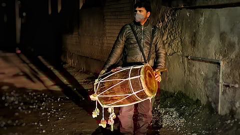Muhammad Altaf, a Sahar Khan, walking through the streets of Srinagar city in Kashmir with his drum – a wake up call before Sahari.
