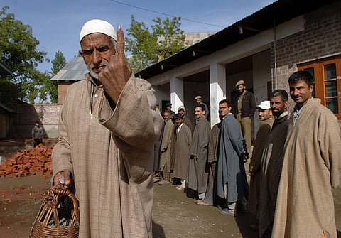 A voter coming out of polling booth in Budgam on May 7, 2009 after casting his vote in Lok Sabha election. Photo/ECI
