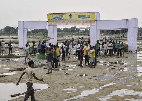 People gather at the Hathras stampede incident site which left 121 people dead during a ‘satsang’ (congregation), at Phulrai village in Hathras on Wednesday, July 03, 2024. Photo/ANI