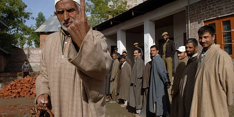 A voter in Budgam district of Kashmir Valley displaying inked finger. Photo/Election Commission of India