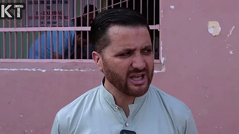 A voter giving his reaction after casting a vote in Assembly Elections in Kashmir.