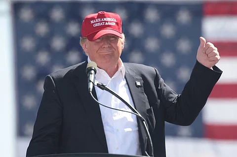 Donald Trump wearing a Make America Great Again cap during his 2016 presidential campaign.