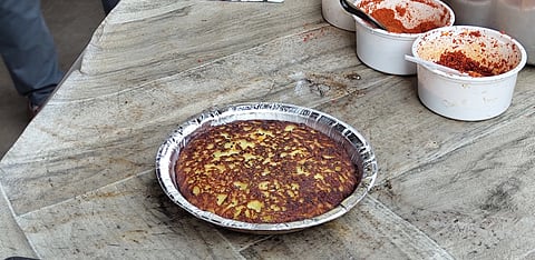 Enjoy traditional Gujarati snacks at Jay Ambe Khichu and Handava Center in Ahmedabad