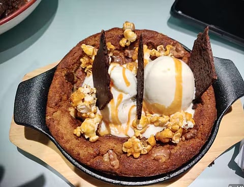 With a pan of Pizookie Bazookie, Khar's Lil Gamby Pizza Shop & Bar unites dessert & pizza!