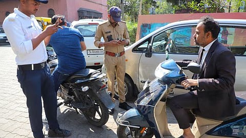 Ahmedabad Police launch strict action against Govt employees flouting helmet & seatbelt rules