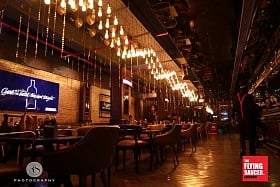 Chug beers or sip on whiskey at half the price at The Flying Saucer Cafe in Lucknow