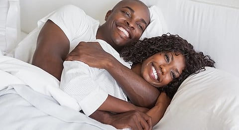 Man And Woman Happy In Bed
