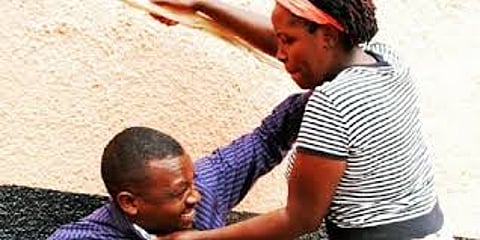 Image of a man and woman fighting