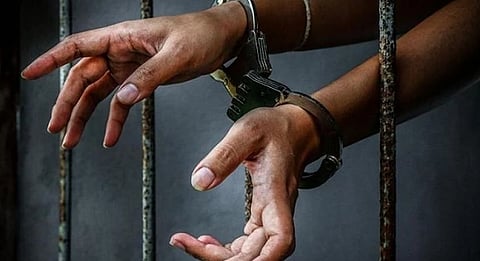 Hands in cuffs