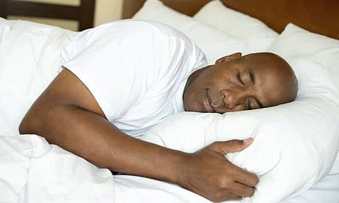 Man in bed sleeping