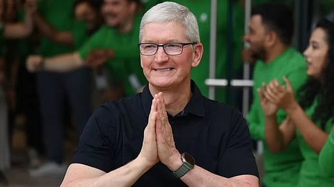 Tim Cook opened the store's doors as employees clapped and cheered
