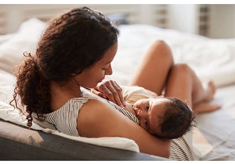 Photo of woman breastfeeding her baby