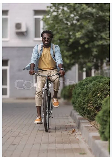 Photo of man riding a bicycle