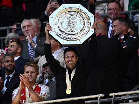 Arsenal manager Mikel Arteta celebrates with the Community Shield during the trophy presentation after beating Manchester City in a penalty shootout
