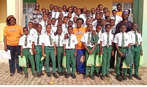 Officials of Open Foundation West Africa (OFWA) with some students and teachers of Federal Government Boys College (FGBC), Wuye, Abuja, during the inauguration of the Kiwix4School app