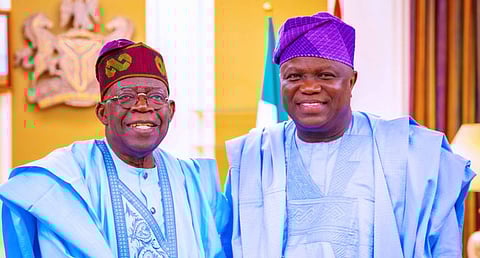 President Bola Tinubu (left), with the Formal Governor of Lagos State, Akinwunmi Ambode