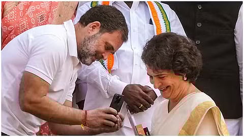 Rahul Gandhi taking pictures of Priyanka Gandhi